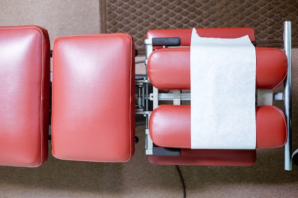 Red adjustment table at a chiropractor's office